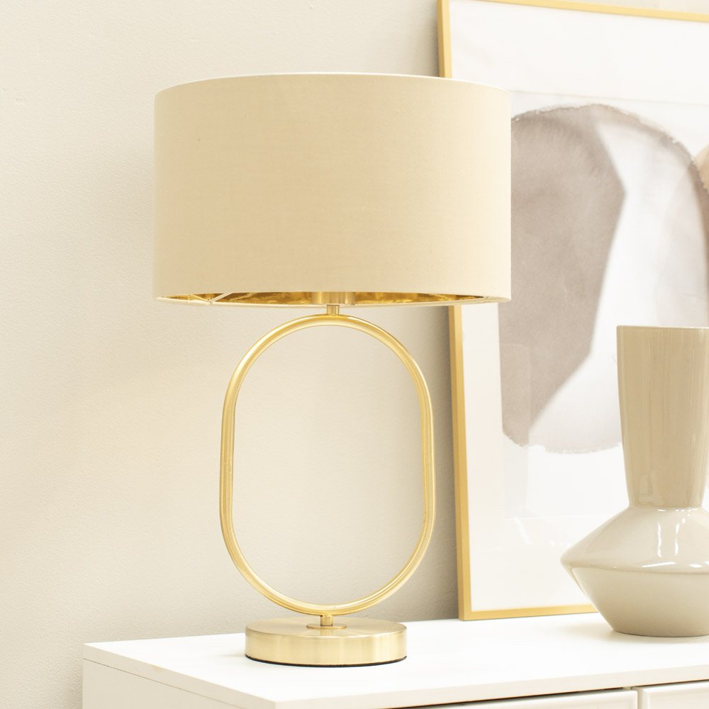 Antonia Brushed Gold Oval Table Lamp with Beige and Gold Shade