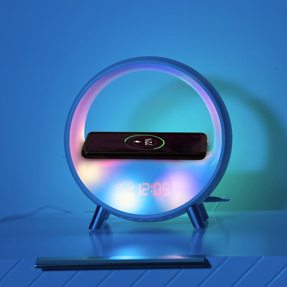 A sunrise alarm clock, wirelessly charging a mobile phone and placed on a bedside table 