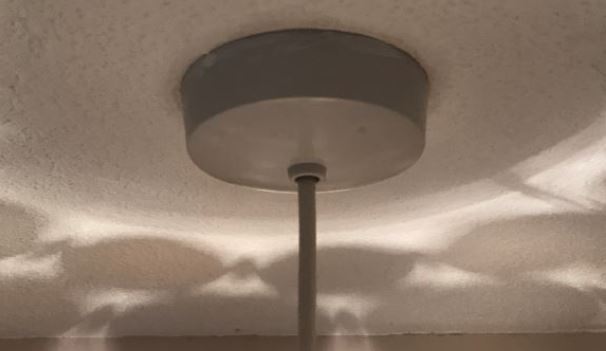 example of a basic ceiling rose on a pendant ceiling light